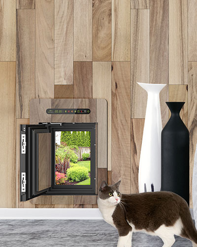 Inside view of a petWALK pet door large installed into wooden wall with custom cover with cat